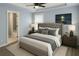 Comfortable bedroom with tray ceiling, ceiling fan, and ensuite bathroom at 3315 Haverhill Rowe, Lawrenceville, GA 30044