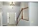 Bright entryway with a staircase and ample natural light shining through the front door at 3315 Haverhill Rowe, Lawrenceville, GA 30044