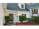 A stately home front door is surrounded by well-maintained landscaping at 3315 Haverhill Rowe, Lawrenceville, GA 30044
