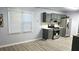 Bright kitchen featuring stylish gray cabinetry, stainless steel appliances, and plenty of natural light at 3315 Haverhill Rowe, Lawrenceville, GA 30044
