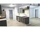 Modern kitchen featuring stylish gray cabinetry, light countertops, and stainless steel appliances at 3315 Haverhill Rowe, Lawrenceville, GA 30044