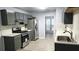 Modern kitchen featuring gray cabinetry, stainless steel appliances, and tile backsplash at 3315 Haverhill Rowe, Lawrenceville, GA 30044