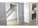 Open-concept floor plan featuring living room with visible staircase and kitchen area at 3315 Haverhill Rowe, Lawrenceville, GA 30044