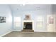 Inviting living room featuring a cozy fireplace, light-filled windows, and modern floors at 3315 Haverhill Rowe, Lawrenceville, GA 30044