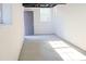 Unfinished basement featuring painted concrete floors, a window, and white walls at 4011 Lake Carlton Rd, Loganville, GA 30052