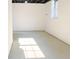 Unfinished basement featuring concrete floors, a window, and white walls at 4011 Lake Carlton Rd, Loganville, GA 30052