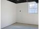 Unfinished basement featuring concrete floors, white painted walls and window at 4011 Lake Carlton Rd, Loganville, GA 30052