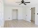 This bedroom features sleek floors, a closet, and two doors at 4011 Lake Carlton Rd, Loganville, GA 30052