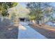 Brick home on a sprawling lot with a long driveway, surrounded by mature trees, providing a sense of privacy at 4011 Lake Carlton Rd, Loganville, GA 30052