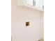 Wall in laundry room featuring electrical outlet, plumbing and white cabinets at 4011 Lake Carlton Rd, Loganville, GA 30052