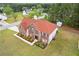 Stunning aerial view of a two-story brick home with well-kept landscaping and a spacious green lawn at 6932 Dalehollow Dr, Lithonia, GA 30058