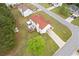Aerial view of the home showing a large yard, patio, deck, and mature trees in a suburban neighborhood at 6932 Dalehollow Dr, Lithonia, GA 30058