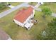 Aerial view of the backyard with patio, deck, gazebo, and ample green space at 6932 Dalehollow Dr, Lithonia, GA 30058