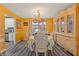 Formal dining room with an ornate chandelier, hutch, and elegant decor at 6932 Dalehollow Dr, Lithonia, GA 30058