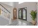 Grand foyer featuring an ornate front door, hardwood floors, and staircase at 6932 Dalehollow Dr, Lithonia, GA 30058