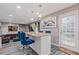 Kitchen bar area with seating, adjacent to cozy living space at 6932 Dalehollow Dr, Lithonia, GA 30058