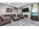 Open-concept living room with comfortable seating, a fireplace, and an aquarium at 6932 Dalehollow Dr, Lithonia, GA 30058