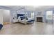 Spacious main bedroom with fireplace, chandelier, wood floors, and a four-poster bed at 6932 Dalehollow Dr, Lithonia, GA 30058