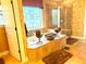Bright bathroom features a soaking tub with decorative window and a separate glass shower, plus attractive tile floors and walls at 7550 Star Magnolia, Lithonia, GA 30058