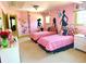 Charming bedroom with two beds, light pink walls and unique modern design at 7550 Star Magnolia, Lithonia, GA 30058