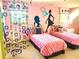 A unique bedroom featuring twin beds and silhouette art decals on the walls at 7550 Star Magnolia, Lithonia, GA 30058