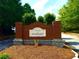 Stonecrest community entrance sign set in brick with lush landscaping and manicured surroundings at 7550 Star Magnolia, Lithonia, GA 30058