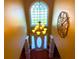 Grand foyer featuring a chandelier, an arched window, and a white front door at 7550 Star Magnolia, Lithonia, GA 30058