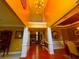 Grand foyer with soaring ceilings, elegant columns, and hardwood flooring at 7550 Star Magnolia, Lithonia, GA 30058