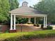 Community gazebo surrounded by lush landscaping offers a shady retreat and a place for residents to gather and enjoy the outdoors at 7550 Star Magnolia, Lithonia, GA 30058
