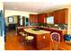 Well-equipped kitchen with a large island, dark cabinetry, and modern appliances at 7550 Star Magnolia, Lithonia, GA 30058