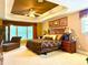 Spacious main bedroom with tray ceiling, large windows and decorative wall art at 7550 Star Magnolia, Lithonia, GA 30058