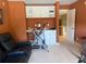 A comfortable sitting area adjacent to white cabinets and exercise equipment at 7550 Star Magnolia, Lithonia, GA 30058