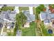 Aerial view of a home with a large backyard, patio, and mature trees at 1130 Lochshyre Way, Lawrenceville, GA 30043