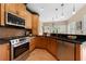 Updated kitchen boasts stainless steel appliances and ample counter space at 1130 Lochshyre Way, Lawrenceville, GA 30043