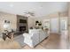 Open living room featuring stone fireplace and neutral decor at 1130 Lochshyre Way, Lawrenceville, GA 30043
