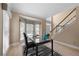 Bright home office with large windows, hardwood floors, and a view of the front yard at 1130 Lochshyre Way, Lawrenceville, GA 30043