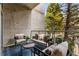 Balcony with outdoor seating, table, and views of the surrounding greenery at 130 Arizona Ne Ave # 104, Atlanta, GA 30307