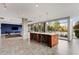 Spacious common area with a large island, bar stool seating, and oversized windows at 130 Arizona Ne Ave # 104, Atlanta, GA 30307