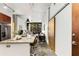 Open concept kitchen with granite island, stainless appliances, and view to the living space at 130 Arizona Ne Ave # 104, Atlanta, GA 30307