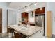 Kitchen island featuring granite countertop, stainless steel appliances, and seating for three at 130 Arizona Ne Ave # 104, Atlanta, GA 30307