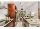 Modern kitchen featuring granite countertops, stainless steel appliances, and an island with a sink at 130 Arizona Ne Ave # 104, Atlanta, GA 30307