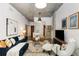 Open-concept living room featuring a modern design, balcony, and hardwood floors at 130 Arizona Ne Ave # 104, Atlanta, GA 30307