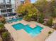 Aerial view of community pool and wooded grounds, including separate seating and spa areas at 130 Arizona Ne Ave # 104, Atlanta, GA 30307