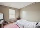 Inviting bedroom with natural light and plush carpet provides a peaceful retreat at 1358 Stoneleigh Way, Stone Mountain, GA 30088