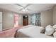 Inviting bedroom with ensuite bathroom, plush carpet, and natural light creates a comfortable space at 1358 Stoneleigh Way, Stone Mountain, GA 30088