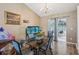 Bright dining area with modern furniture and glass table with hardwood flooring at 1358 Stoneleigh Way, Stone Mountain, GA 30088