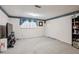 Spacious living room with large window, plush carpet, and ample space for furniture at 1358 Stoneleigh Way, Stone Mountain, GA 30088