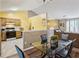 Open concept living space features a living room, dining area and kitchen with vaulted ceiling at 1358 Stoneleigh Way, Stone Mountain, GA 30088