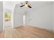 Cozy bedroom with hardwood floors, ceiling fan, and window providing natural light at 2032 Spink Nw St, Atlanta, GA 30318