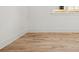 A corner of an empty room showing the hardwood floors and the neutral-painted walls at 2032 Spink Nw St, Atlanta, GA 30318